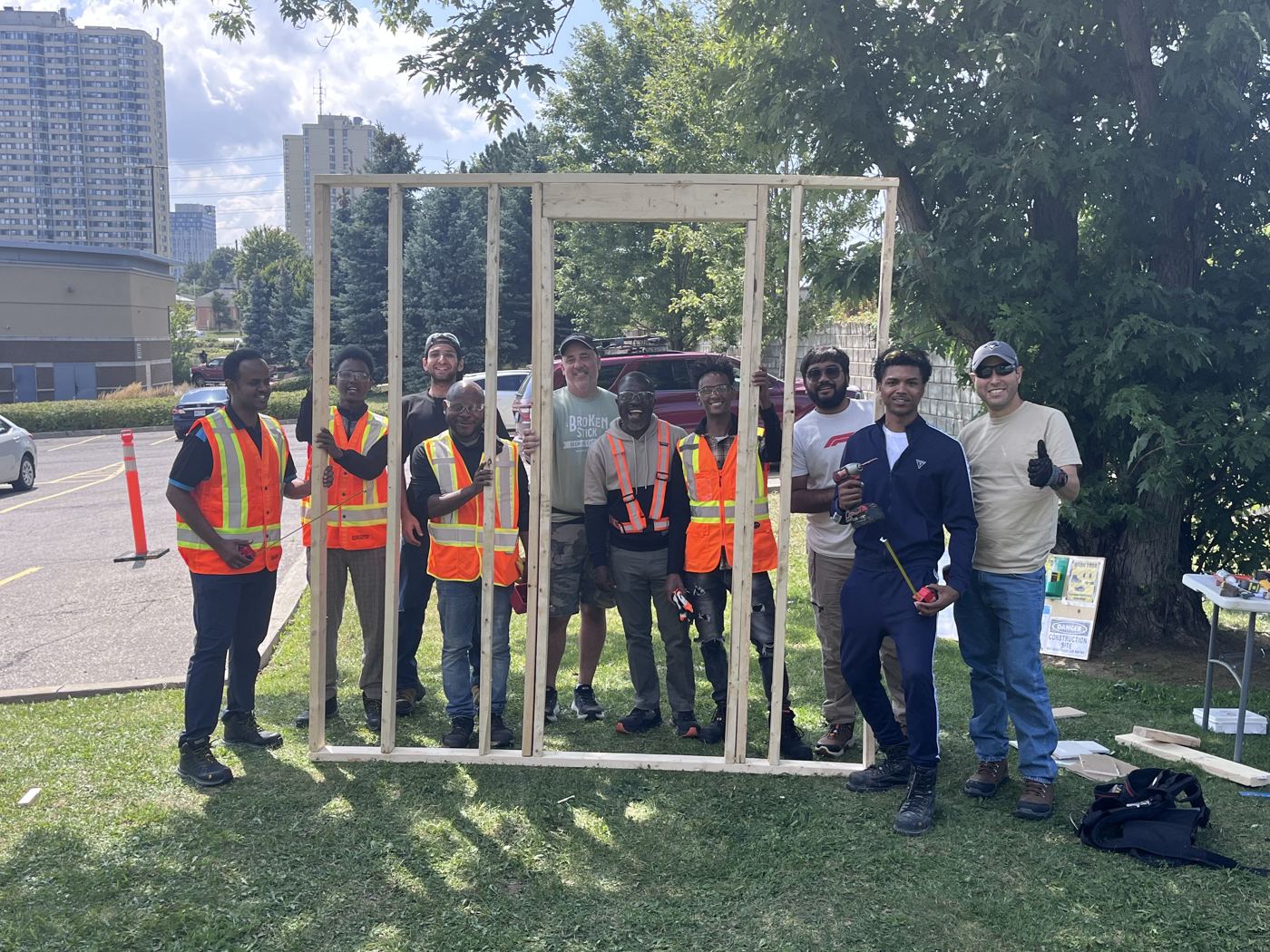 Training cohort standing inside the wall they framed